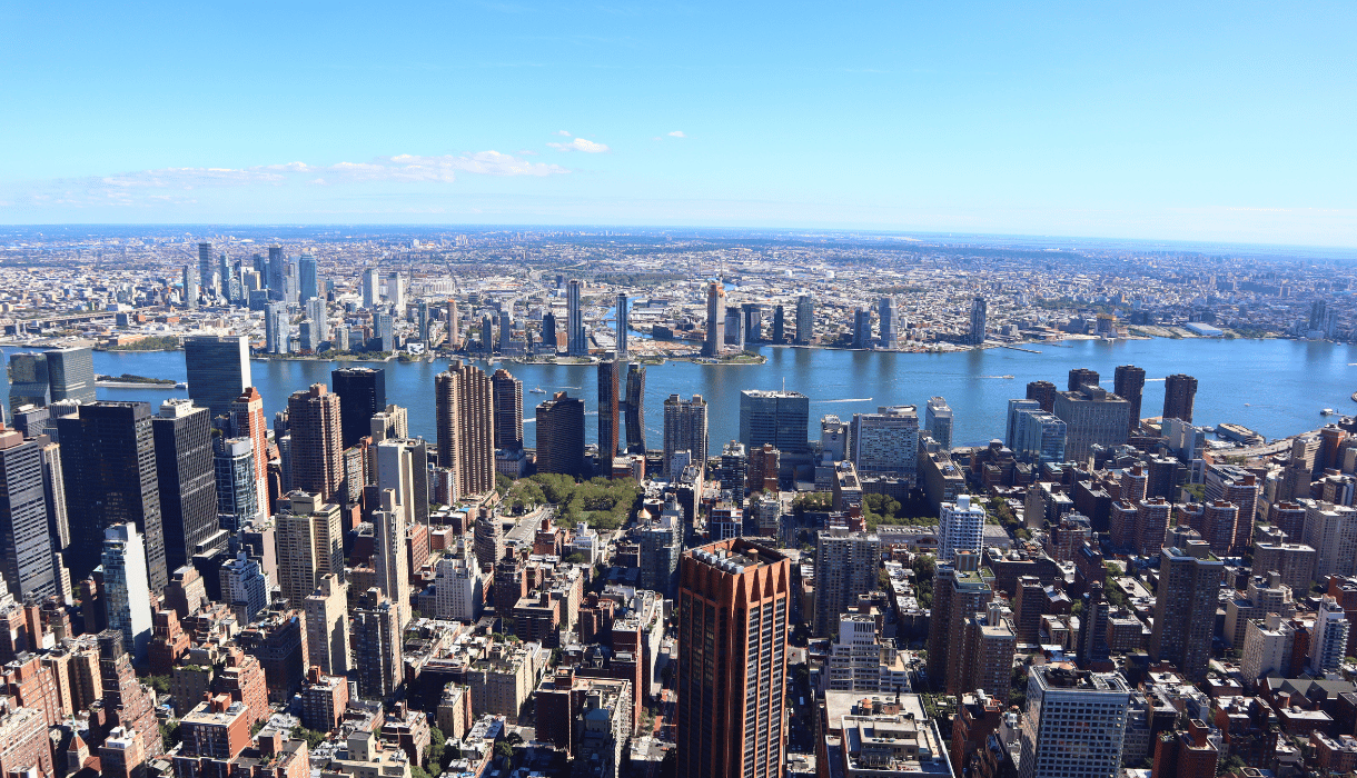 Aerial view of Brooklyn's skyline featuring modern buildings, waterfront, and expansive urban landscape, highlighting real estate opportunities and local insights in Brooklyn.